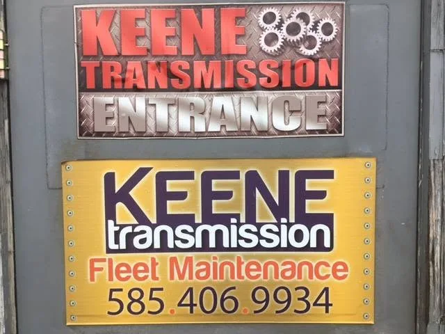 The Keene Transmission entrance sign above the shop’s fleet maintenance sign