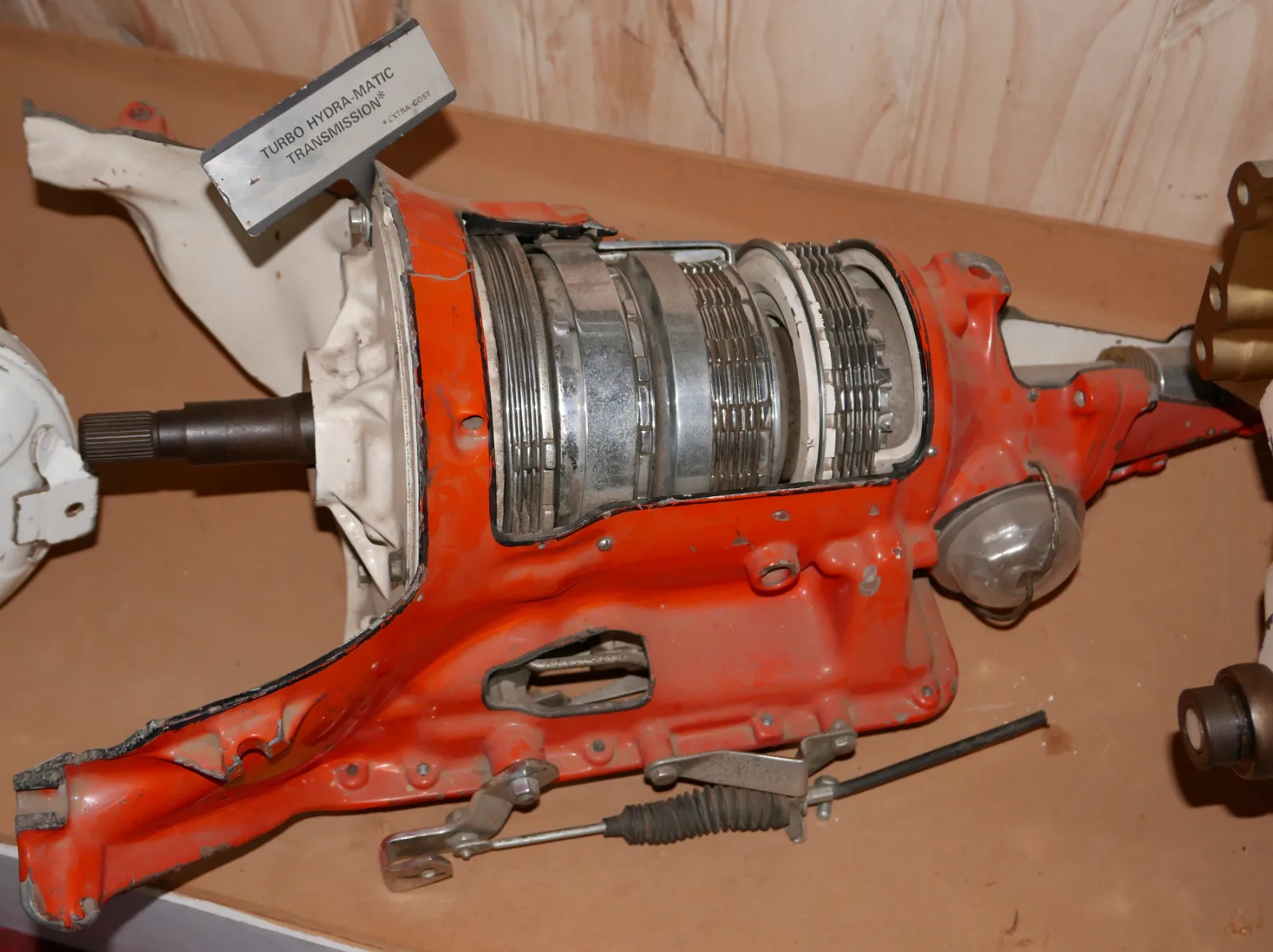 An orange Turbo Hydra-Matic automatic transmission, cut away to show its clutch packs